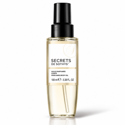 Huile Parfumée Corps Secrets de Sothys en flacon transparent, liquide doré et pompe noire, 100 ml
